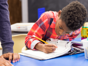 A youth working on homework