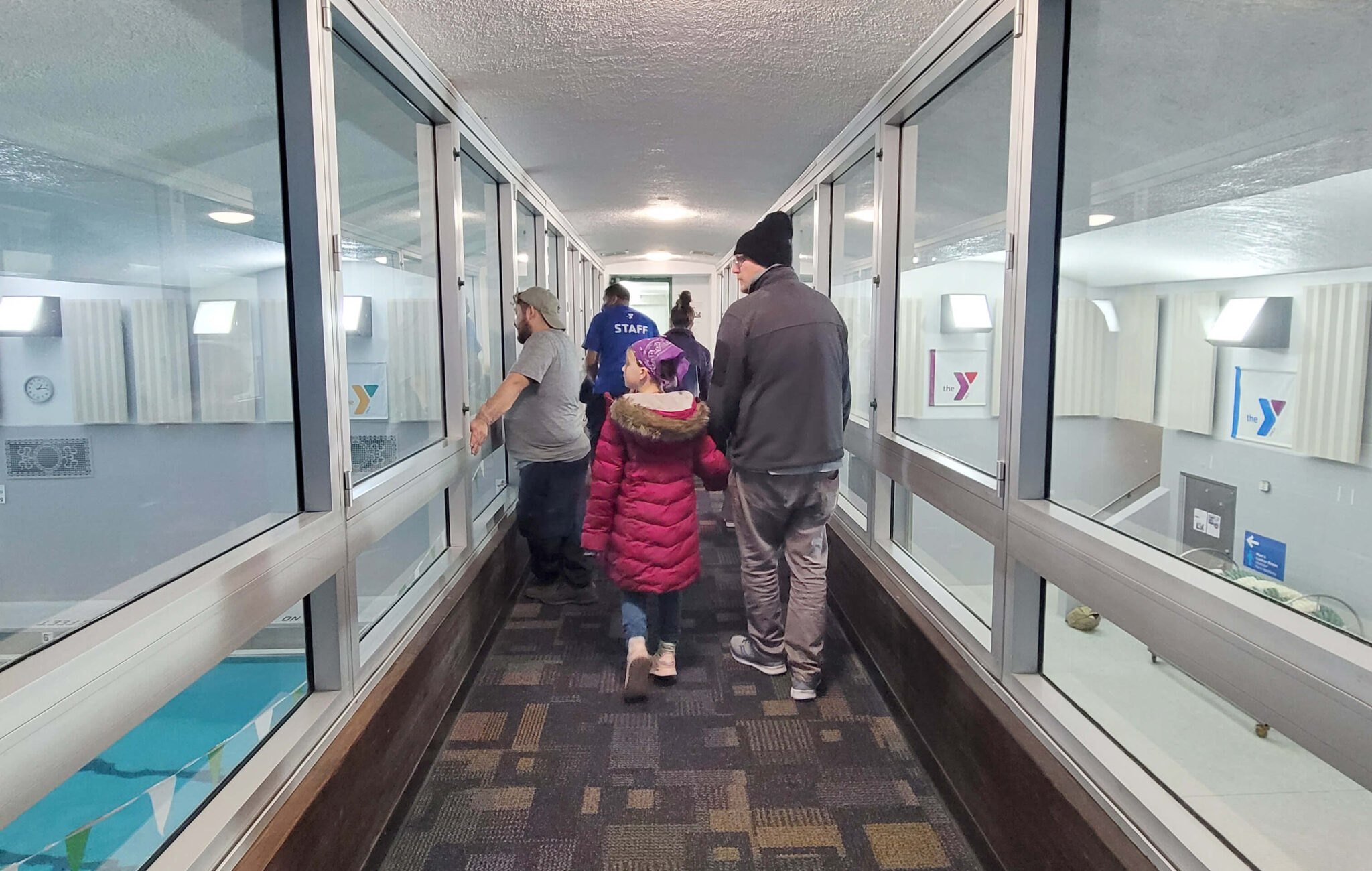 A group of people taking a tour at the Y
