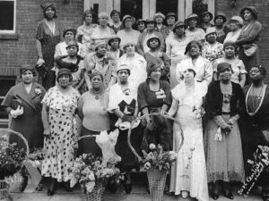 A group of Black mothers posing outside of the Emerson Street YMCA.