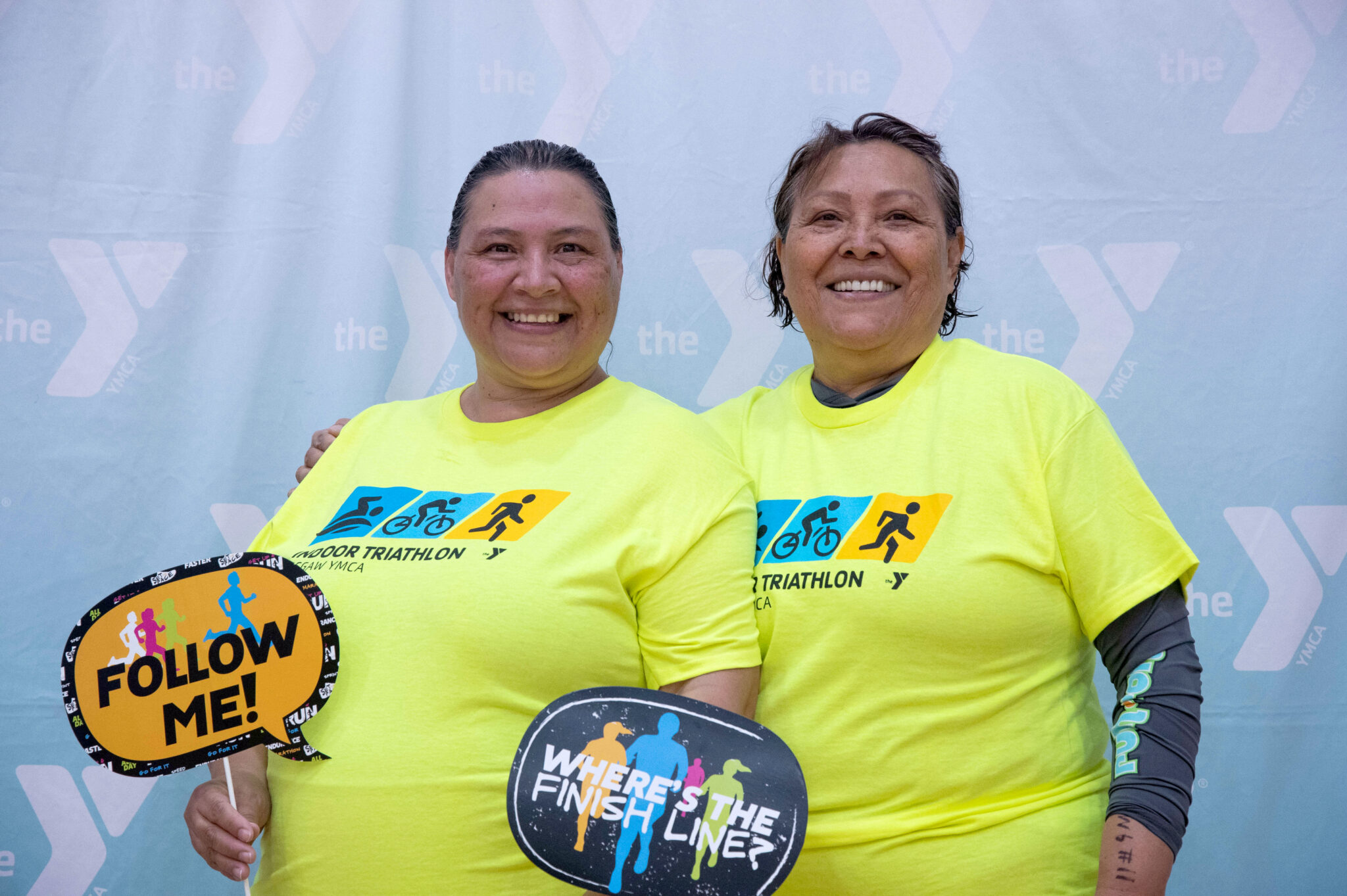 Two people smiling after finishing the McGaw Y triathlon