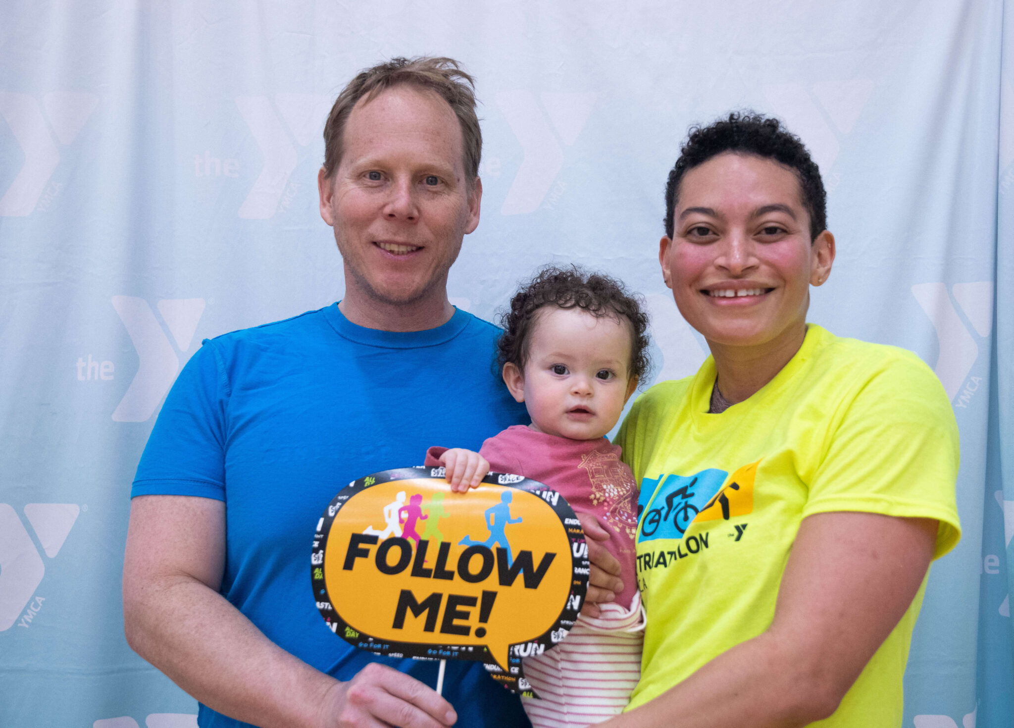 A family smiling after finishing the McGaw Y triathlon