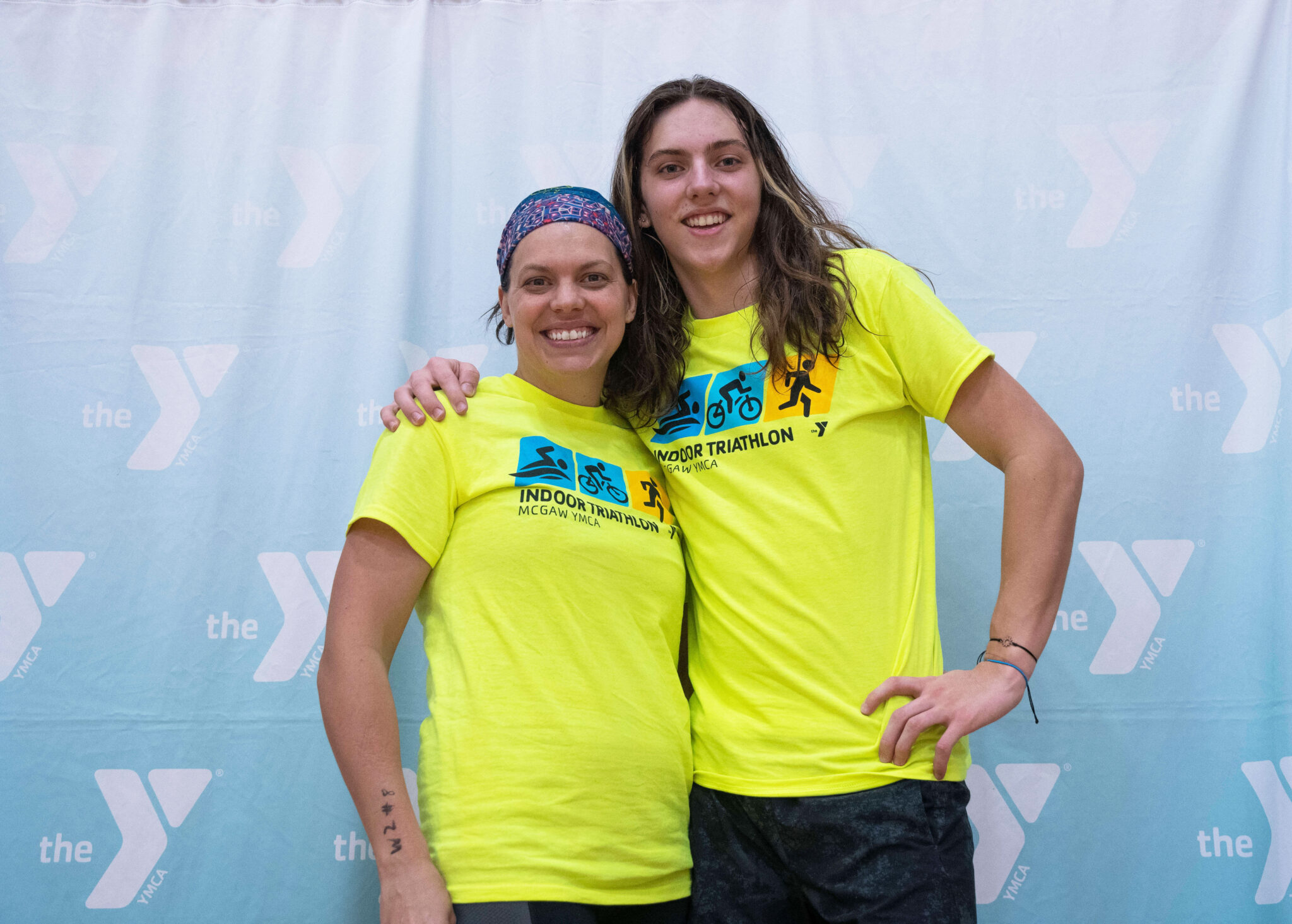 Two people smiling after finishing the McGaw Y triathlon