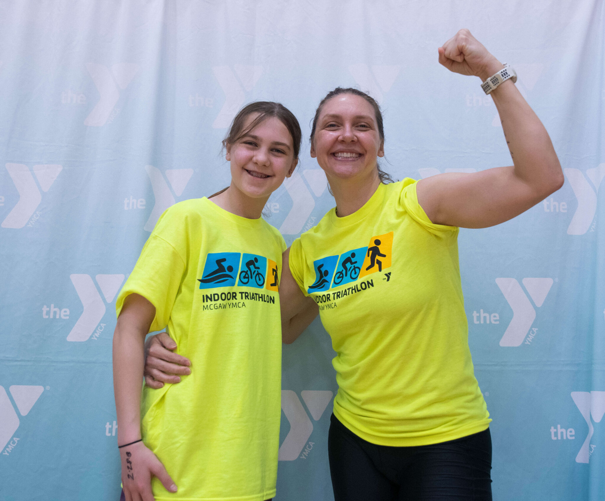 Two people smiling after finishing the McGaw Y triathlon