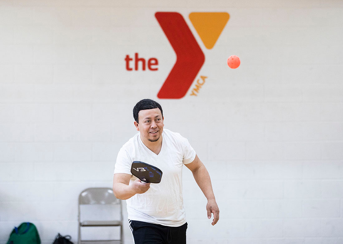 A person playing pickleball at the YMCA