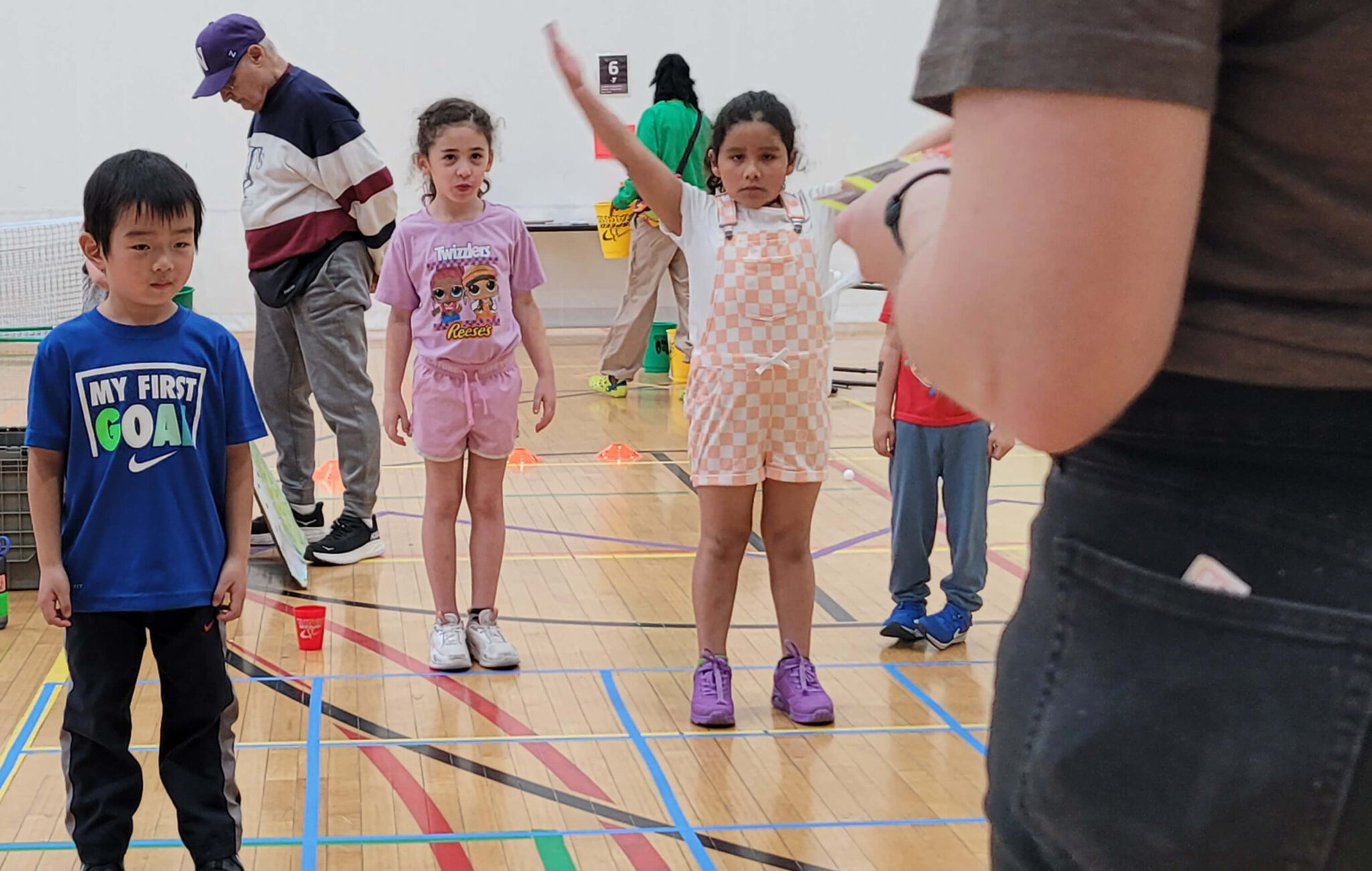 A group of children lined up to play a game.