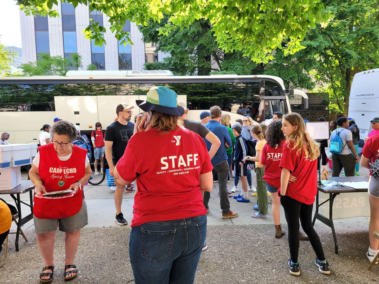 Camp Echo saff and Spirit Team preparing for the bus departuers.