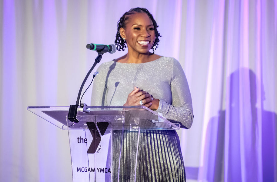 The McGaw Y President/CEO smiling at the audience.
