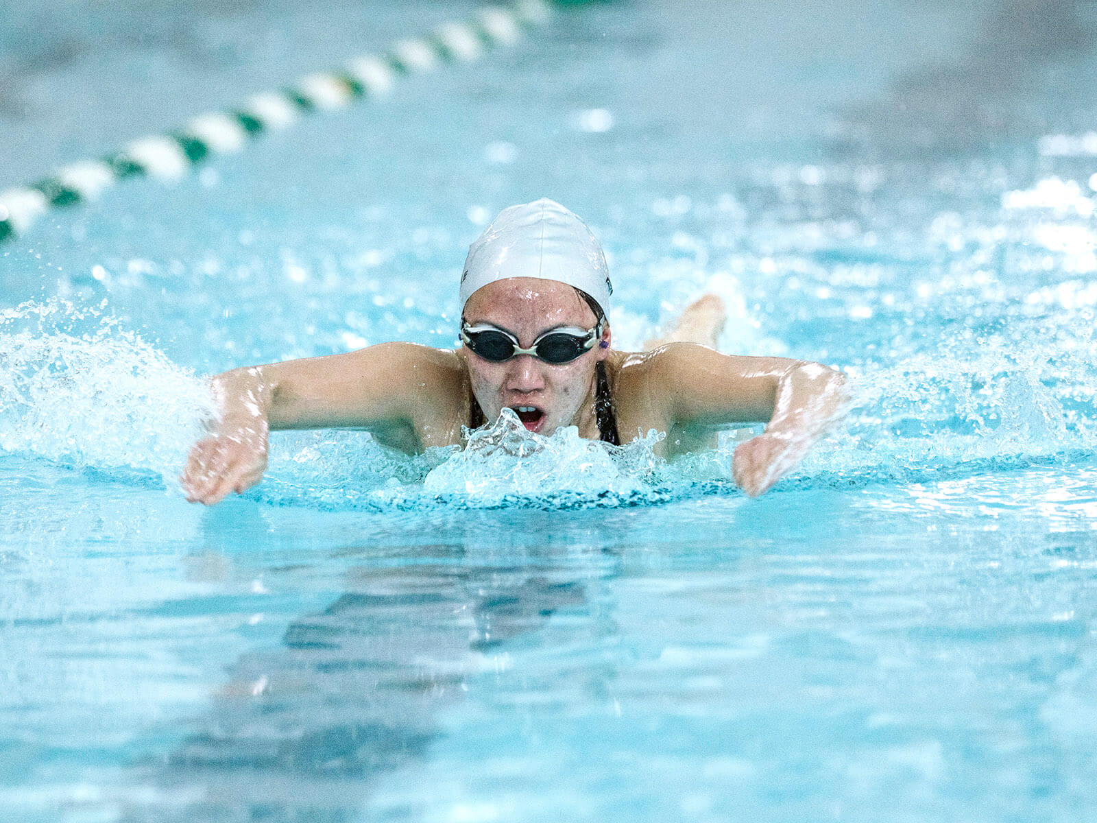 A person swimming in the pool