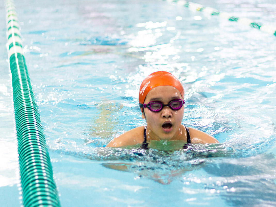 youth swimming in pool